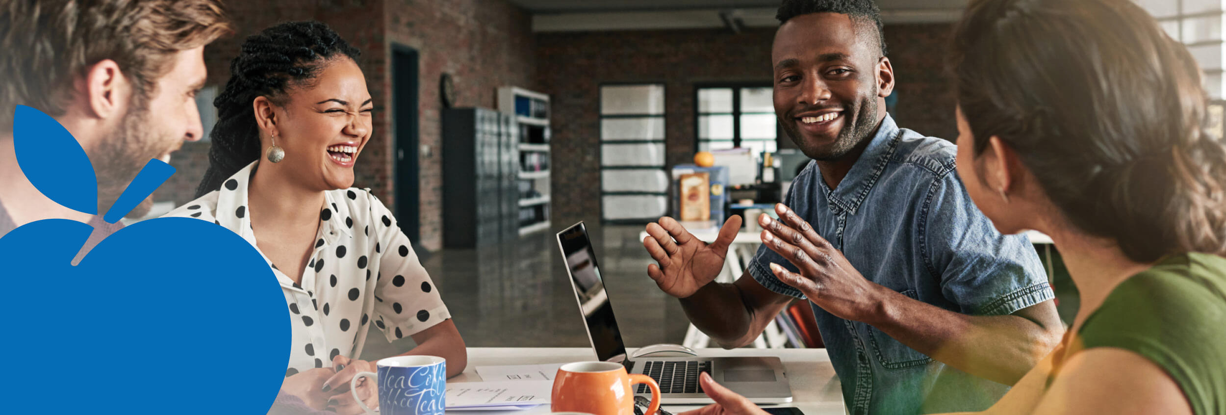 2025 Apple Bank Header Photos20 Group of smiling employees chatting around conference table