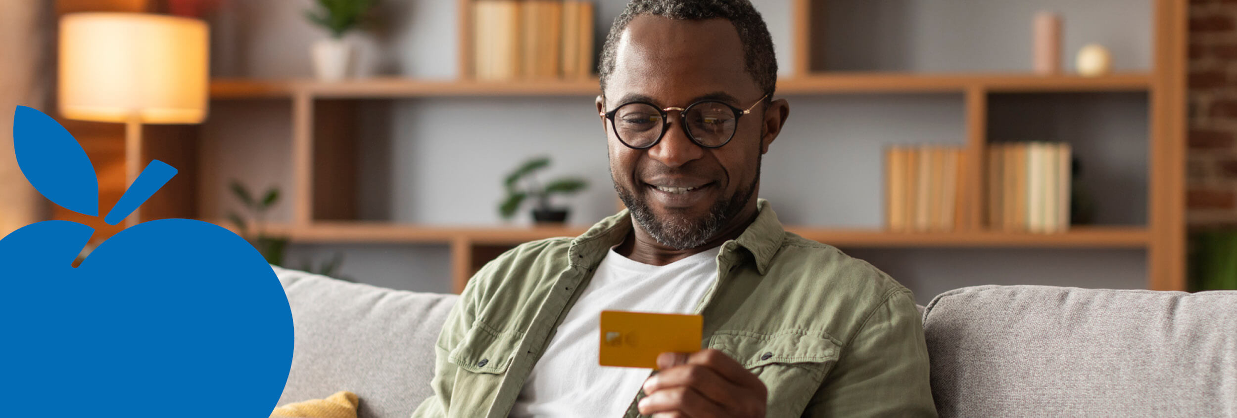 2025 Apple Bank Header Photos3 Man reviewing benefit card.